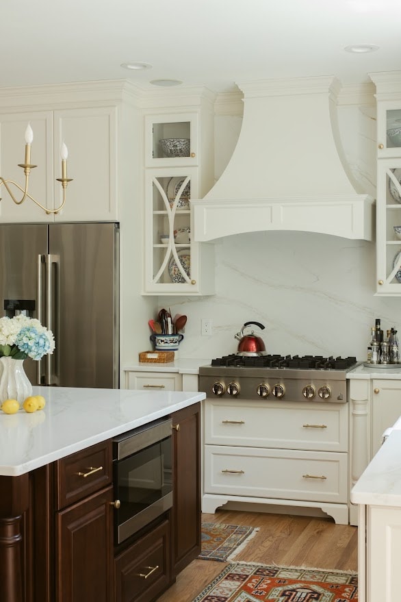 Kitchen with marble backsplash and range