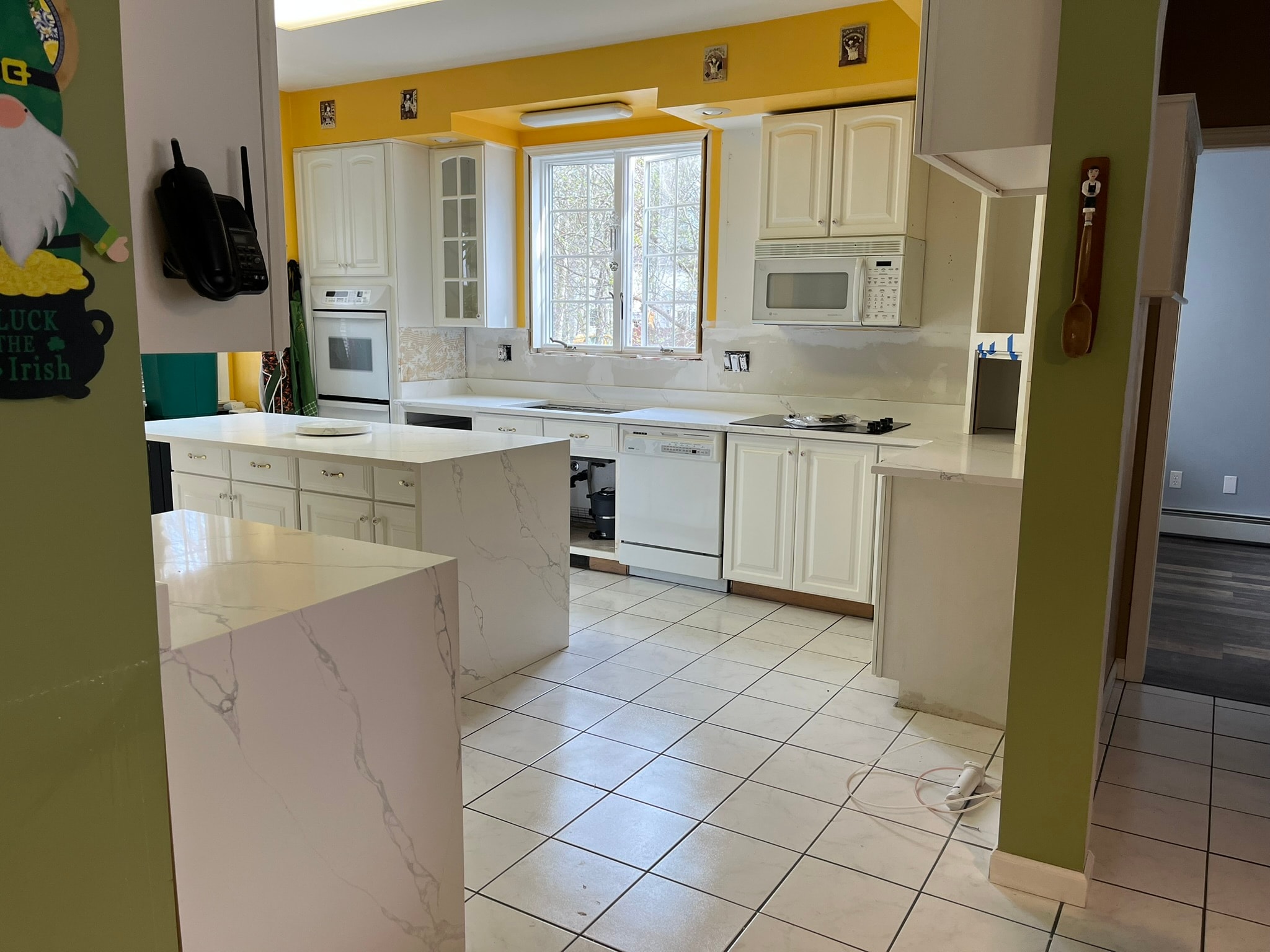 Kitchen with white marble countertops